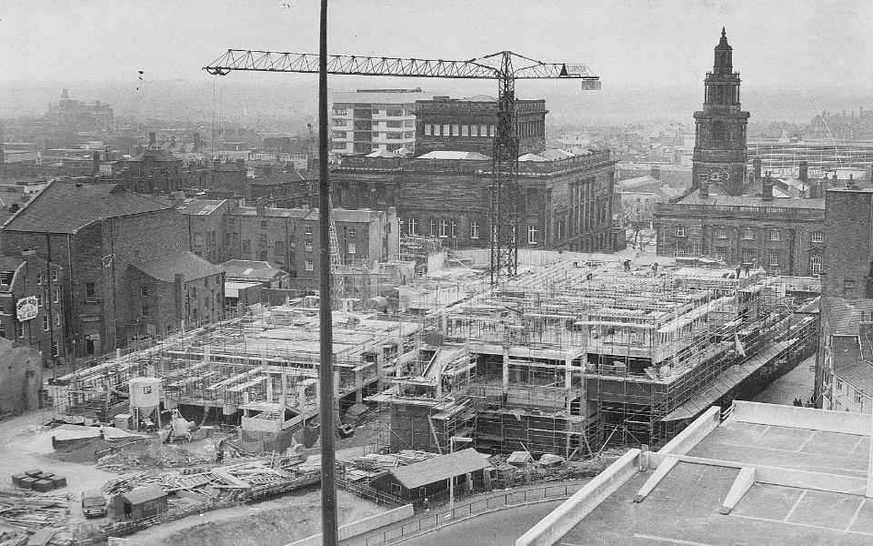 A black and white picture of the Guild Hall in its building stage.